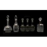 A set of three cut-glass decanters,
