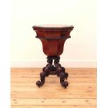 A Victorian flame mahogany teapoy by Gillows of Lancaster,