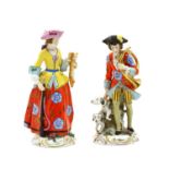 A pair of Continental porcelain figurines,
