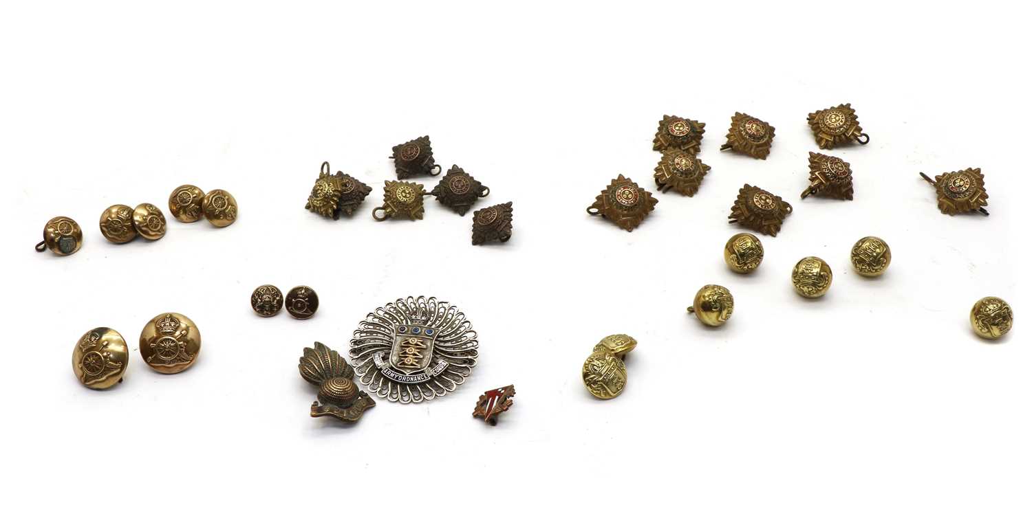 A collection of military uniform buttons,