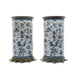 A large pair of porcelain stick stands,