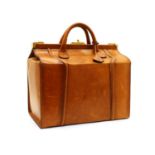 A brown leather Gladstone bag,