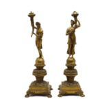 A pair of figural bronze table lamps