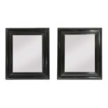 A pair of ebonised mirrors,