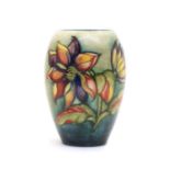 A Moorcroft tubeline decorated 'Dahlia' pattern vase,