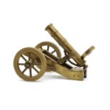 A scratch built brass model of a field cannon or Maxim gun,