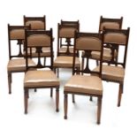 A set of eight Art Nouveau walnut dining chairs,