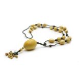 An ivory bead necklace,
