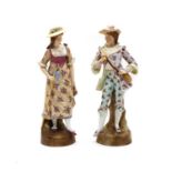 A pair of continental porcelain figurines,