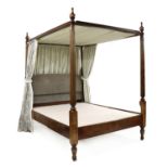 A reproduction ash four poster bed,