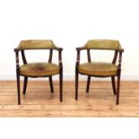 A pair of Continental mahogany open armchairs,