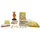 An assortment of Rupert the bear annuals and jigsaws,