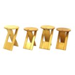 Four Roger Tallon folding stools,