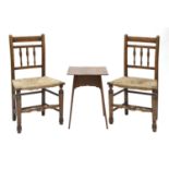 A pair of Arts and Crafts oak side chairs,