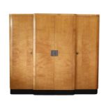 An Art Deco maple and ebonised breakfront wardrobe,