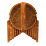 An Art Deco walnut ‘Rocket’ display cabinet,