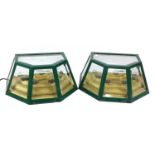 A pair of green wall lights,