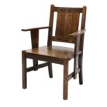 An Arts and Crafts oak elbow chair,