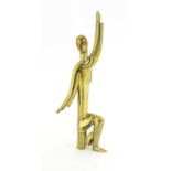 A Hagenauer polished brass figure of a kneeling man,