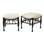 A pair of ebonised Thebes-style stools,