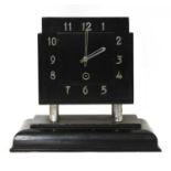 An Art Deco ebonised mantel clock,