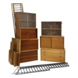 A collection of teak wall-mounted cabinets,