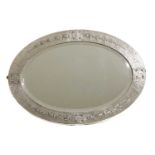An Arts and Crafts silvered copper wall mirror,