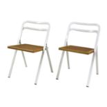 A pair of folding chairs,