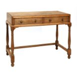 A Cotswold School oak dressing table,