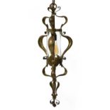 An Arts and Crafts brass hanging hall lantern,