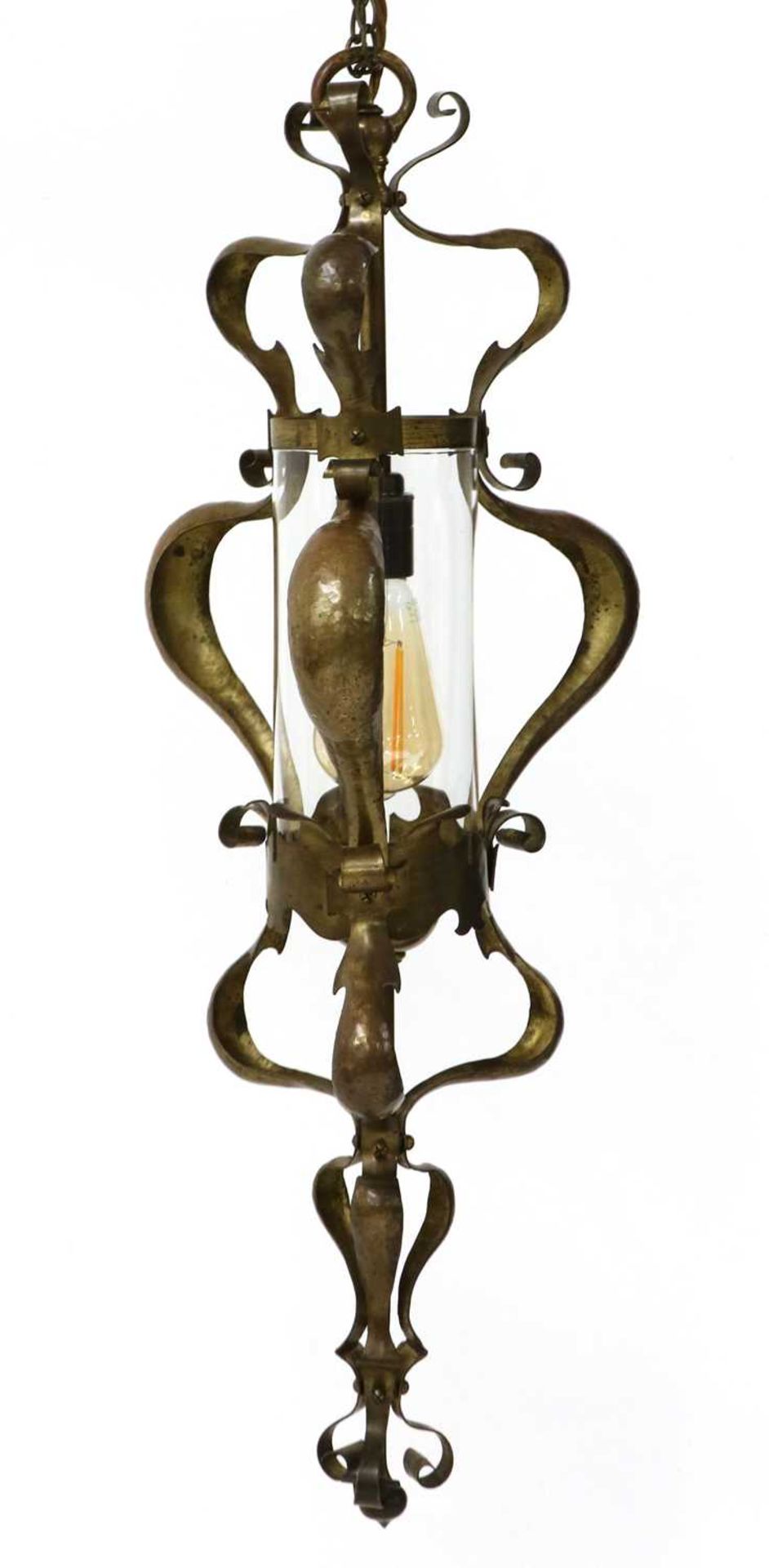 An Arts and Crafts brass hanging hall lantern,