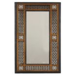 An Aesthetic Movement Moorish mahogany mirror,