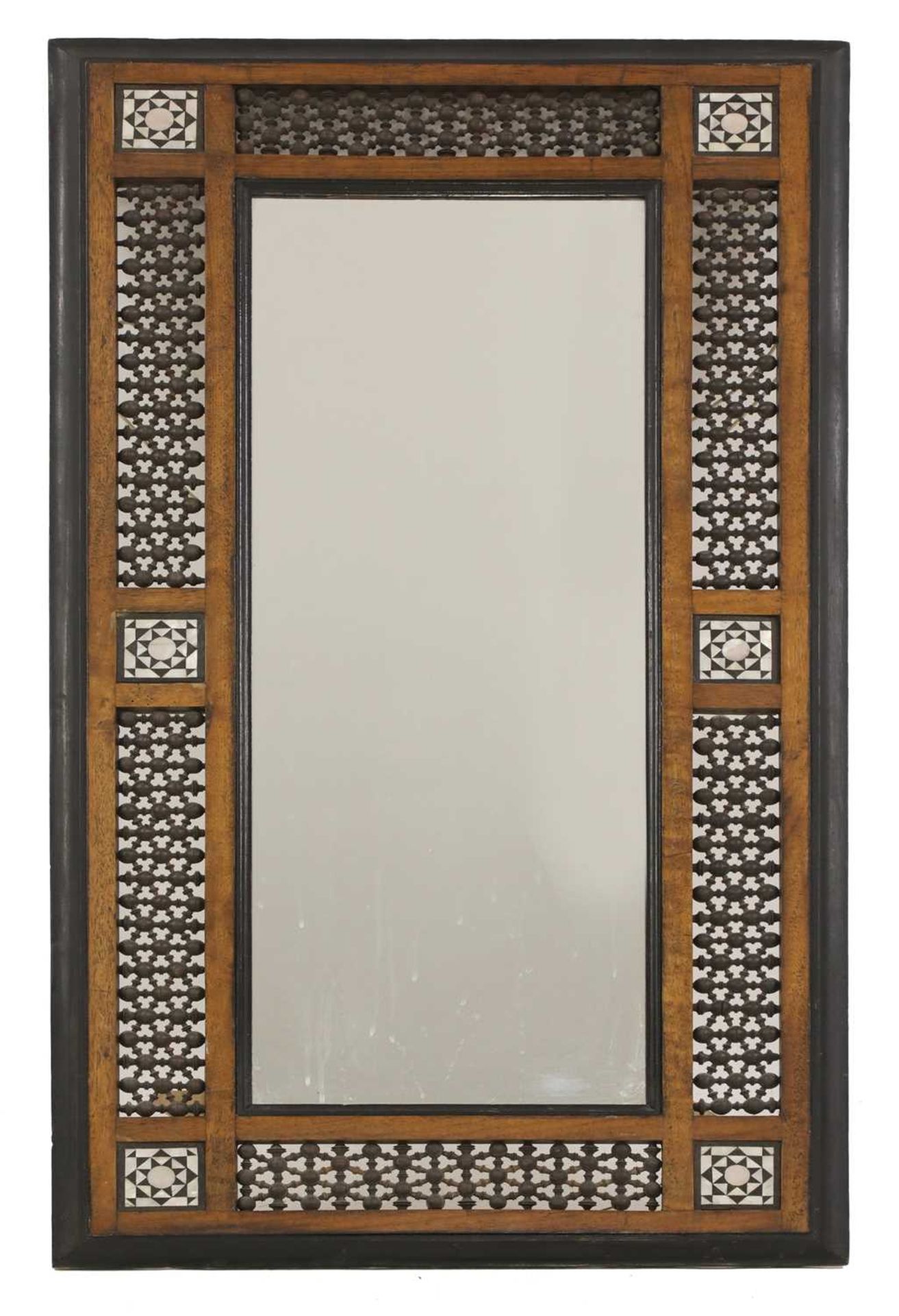 An Aesthetic Movement Moorish mahogany mirror,