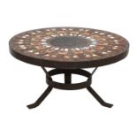 A circular tile-topped coffee table,