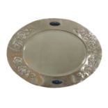 An Arts and Crafts silver-plated oval wall mirror,