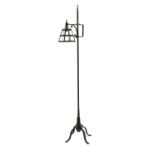 An Arts and Crafts wrought iron standard lamp,