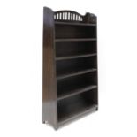 An Arts and Crafts stained oak bookcase,