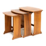 An Art Deco walnut nest of three tables,