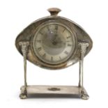 An Arts and Crafts silver-plated desk clock,