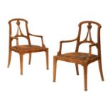 A pair of Art Nouveau walnut armchairs,