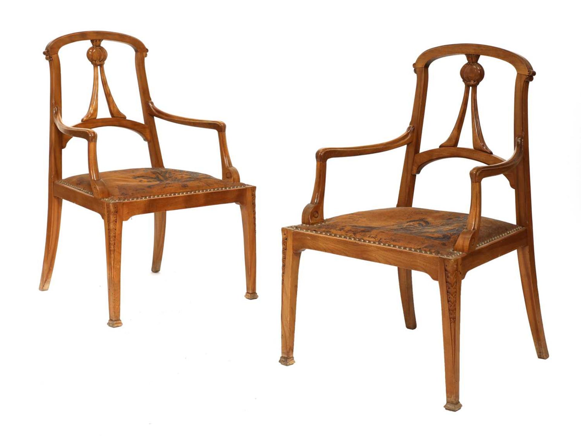 A pair of Art Nouveau walnut armchairs,