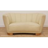 An Art Deco cream leather settee,