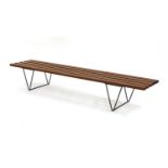 A teak slatted bench,