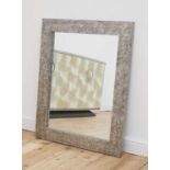 A contemporary cast aluminium mirror,