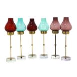 A set of six brass and glass candlesticks,