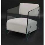 A contemporary glass armchair,