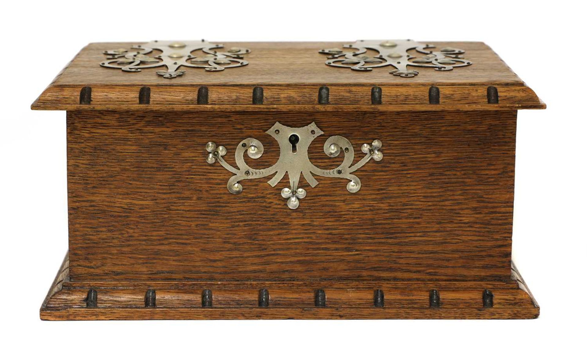 An Arts and Crafts oak and pewter-mounted casket,