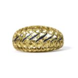 A gold enamel pierced ring,