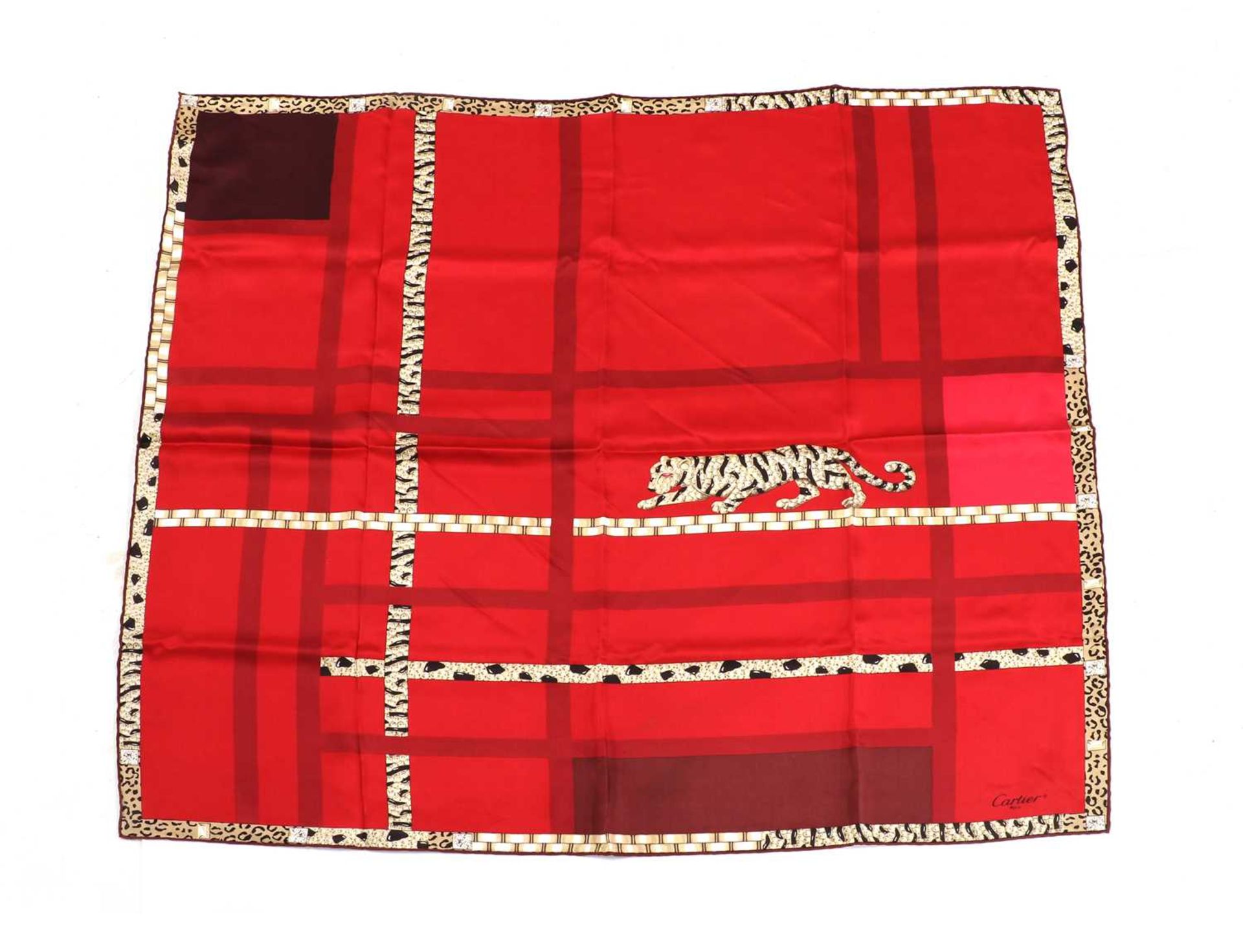 A Cartier red silk panther scarf,