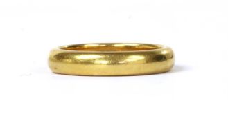 A 22ct gold 'D' section wedding ring,